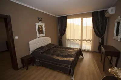 a bedroom with a bed and a window at The Red Lozenets in Lozenets