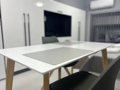a white table and chairs in a room at NJ bedroom in Varna City