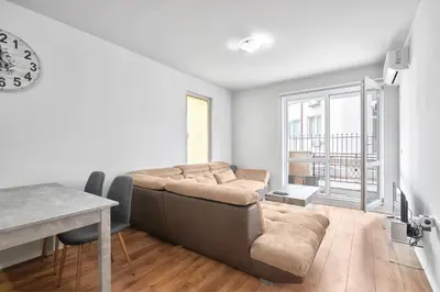a living room with a couch and a table at Private 1-BD Apartment with Balcony in Sveti Vlas by Flat Mаnаger in Sveti Vlas