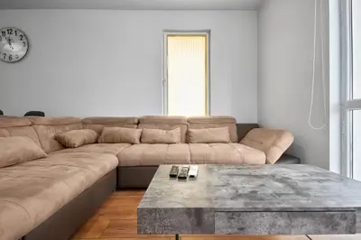 a living room with a couch and a coffee table at Private 1-BD Apartment with Balcony in Sveti Vlas by Flat Mаnаger in Sveti Vlas