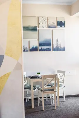 a dining room with a table and a chair at Burgas Residence 504 l Indoor Parking l Breakfast & SPA available in Burgas City