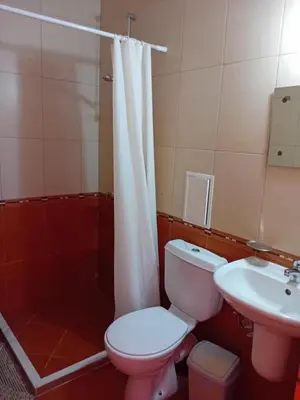 a bathroom with a toilet and a sink and a shower at Златна Дюна - до южния плаж на Несебър in Nesebar