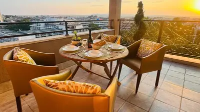 a table and chairs on a balcony with a view at Luxury sea view, 5star Barcelo on Beach in Sunny Beach