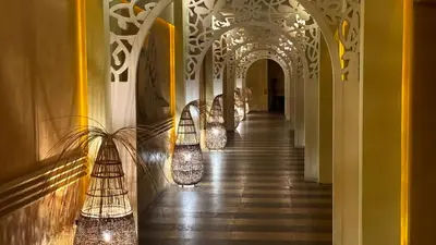 a hallway with lights on the walls of a building at Luxury sea view, 5star Barcelo on Beach in Sunny Beach