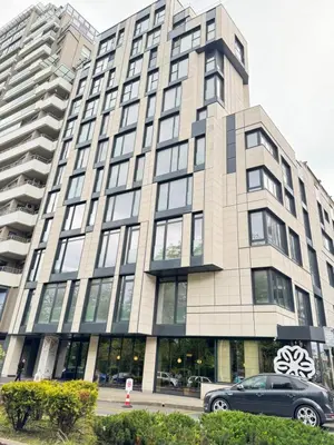 a building with a car parked in front of it at Kandinski Lux Apart in Burgas City