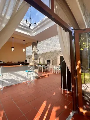an open patio with a table and chairs at Luxury Apartments in Cascadas Family Resort Sunny Beach in Sunny Beach