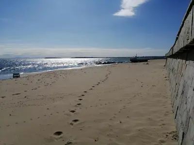 a footprints in the sand on a beach at Garden of Eden - Sea View studio in Sveti Vlas