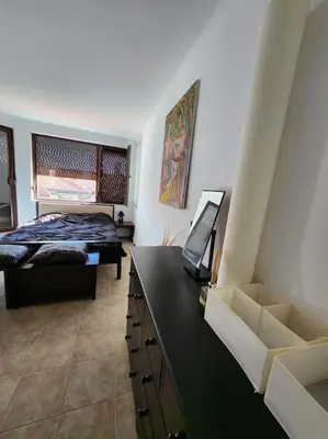 a bedroom with a bed and a black counter top at Bay view villas sunny beach entire villa in Kosharitsa