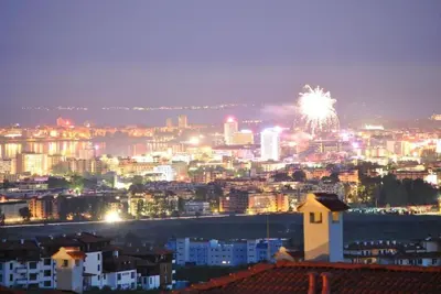 a view of a city with fireworks in the sky at Bay view villas sunny beach entire villa in Kosharitsa