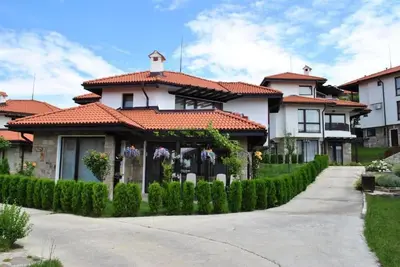 a house with a tiled roof and a driveway at Bay view villas sunny beach entire villa in Kosharitsa