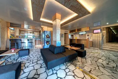 a lobby of a hotel with couches and a bar at Paloma - in the center of the city in Sunny Beach