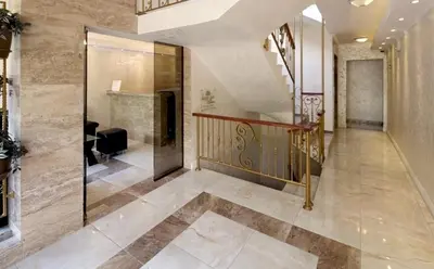 a hallway of a house with a staircase and a stair case at Уютно студио до морето - апартаменти 25 и 26, топ локация - Cozy Studio by the Sea - Apartments 25 and 26 Top Location in Sveti Vlas
