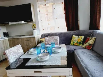 a living room with a couch and a coffee table at Guest Apartment Rusalka in Sveti Vlas