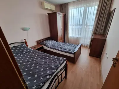 a hotel room with two beds and a window at Roof top sea view apartment 167,2ložnice,4-7 osob in Sveti Vlas