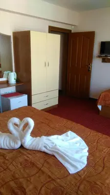 a swan made out of towels on a bed at Guest House Aristokrat in Obzor