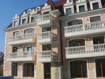 a large building with balconies on the side of it at Guest House Aristokrat in Obzor