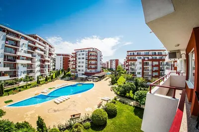 an apartment with a swimming pool and some buildings at 1kk ve Sveti Vlas in Nesebar