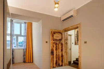 a room with a door and a window at Elite place Suite in Varna City