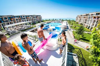 a group of people standing on the balcony of a resort at Premier Fort Cuisine - Full Board in Sunny Beach