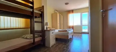 a bedroom with two bunk beds and a window at Villa Byala Grape House in Byala