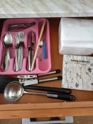 a pink tray with utensils on a table at Bay View Villas apartment NONA 1C - Kosharitsa in Kosharitsa