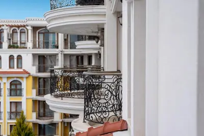 a balcony of a building with a building at Harmony Suites - Monte Carlo in Sunny Beach