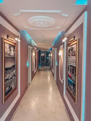 a hallway in a building with paintings on the walls at Urlaub in Harmony in Sunny Beach