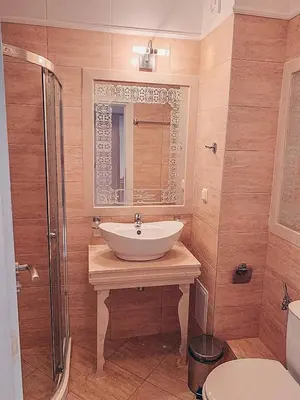a bathroom with a sink and a mirror and a shower at Urlaub in Harmony in Sunny Beach
