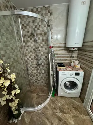 a bathroom with a shower and a washing machine at Sweet Homes 2 Apartments in Sunny Beach