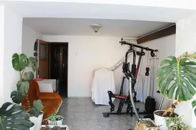 a room with plants and a room with a treadmill at Hotel Bobchev in Sozopol