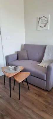 a living room with a couch and a coffee table at Kate`s Place in Burgas City