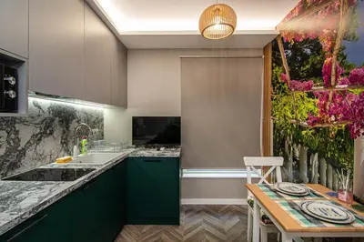 a kitchen with green cabinets and a sink at Tiny studio in center of Varna in Varna City