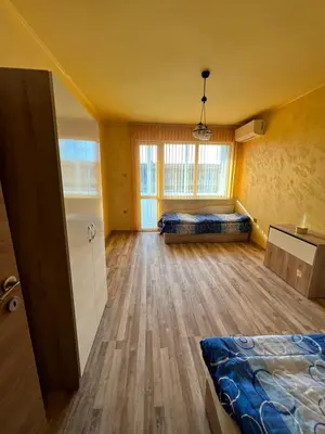 a large room with a bed and a window at Varna Top Central Apartment-Tulip in Varna City