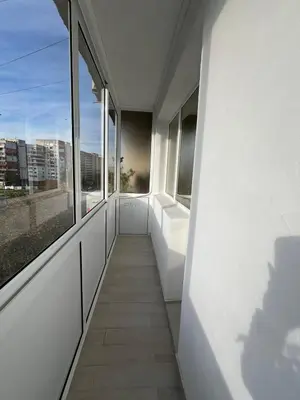an empty hallway with windows in a building at Varna Top Central Apartment-Tulip in Varna City