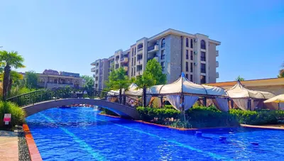 a bridge over a river in a city with buildings at Attractive Apartment in Sunny Beach Cascadas Family Resort in Sunny Beach