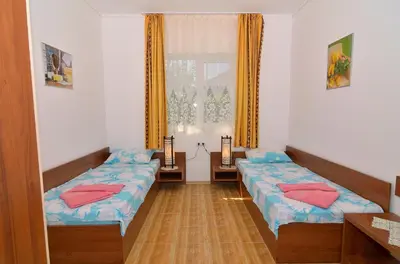a room with two beds and a window at BulgariaVilla - Royal Villas in Bryastovets