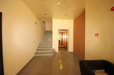 a long hallway with stairs in a building at Menada Dune Residence Apartments in Sunny Beach