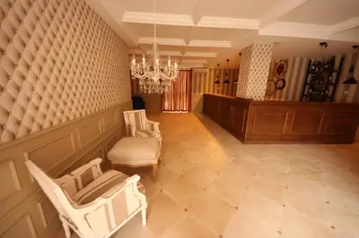 a living room with chairs and a court sidx sidx sidx at Menada Romance Marine Apartments in Sunny Beach