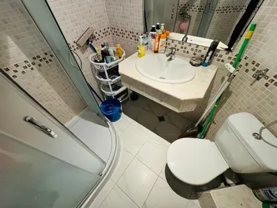 a bathroom with a shower and a toilet and a sink at VICTORIA RESIDENCE Two Bedroom Sunny Beach in Sunny Beach