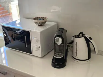 a microwave and a coffee maker on a counter at Apartment Sunny Seasons Byala in Byala