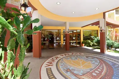 a lobby of a building with a sign on the floor at Yavor Palace Hotel - All Inclusive in Sunny Beach