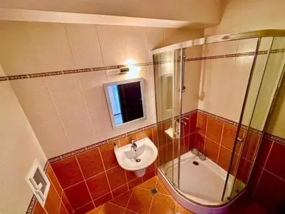 a bathroom with a sink and a shower and a toilet at Apartament w Bułgarii in Sveti Vlas