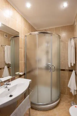 a bathroom with a shower and a sink at Family Hotel Berlin Beach Sveti Vlas in Sveti Vlas