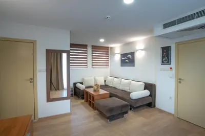 a living room with a couch and a table at Family Hotel Berlin Beach Sveti Vlas in Sveti Vlas