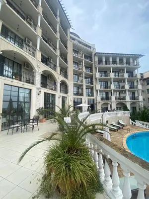 a large apartment building with a swimming pool and a resort at The Cliff Lux Apartment Obzor, Burgas, Bulgaria in Obzor