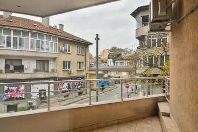 a balcony with a view of a city street at Central gem for 2 next to beach in Varna City