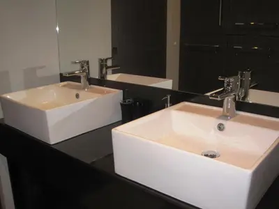 a bathroom with two sinks and a mirror at Apartment Alegria in Varna City