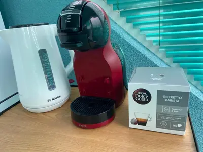 a coffee maker and a box on a table at Sunrise Sea Garden in Burgas City