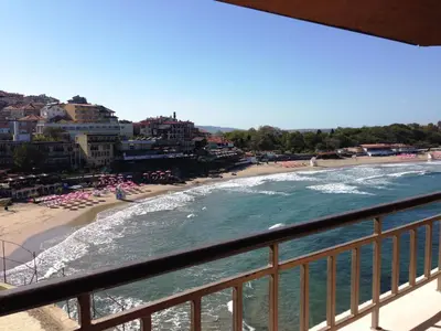 a view of a beach from a balcony at Hotel Parnasse in Sozopol