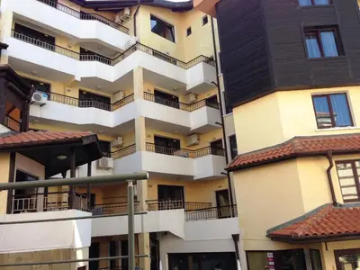 an apartment building with balconies on the side of it at Hotel Parnasse in Sozopol